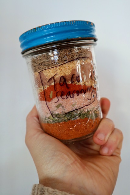 Homemade taco seasoning in a labeled mason jar.