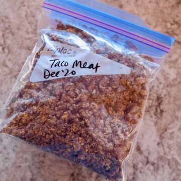 Cooked taco meat in a quart freezer bag.