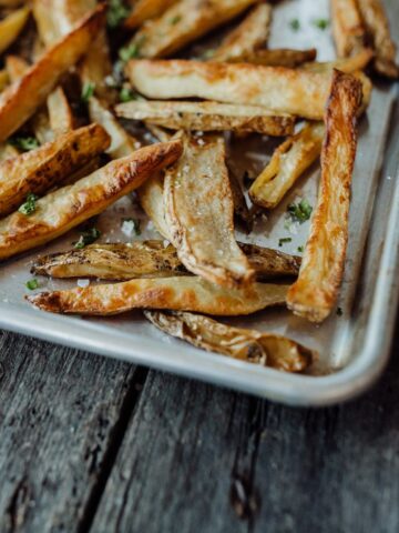 Tallow roasted oven fries on a sheet pan.