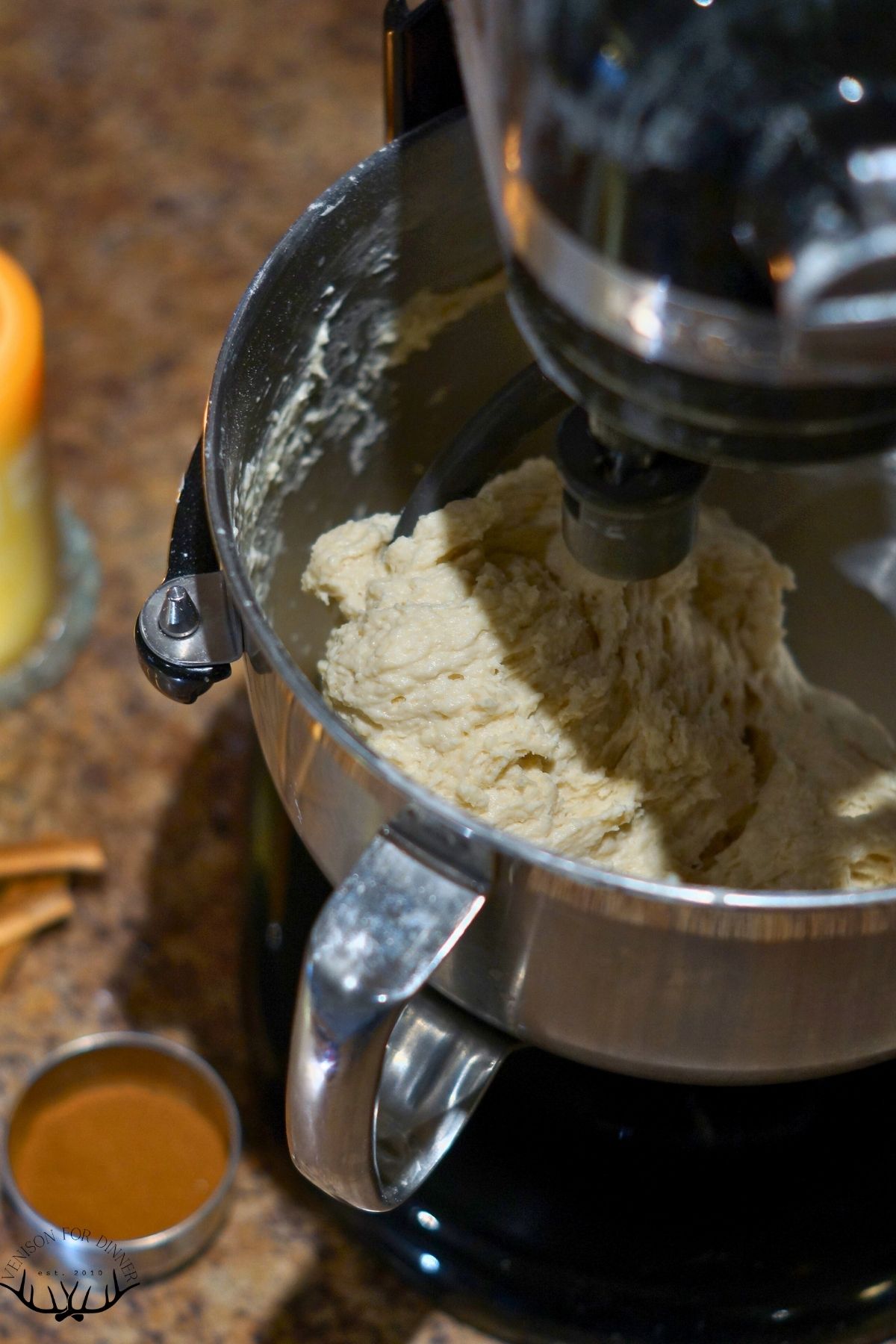 Sourdough bread in a stand mixer bowl.