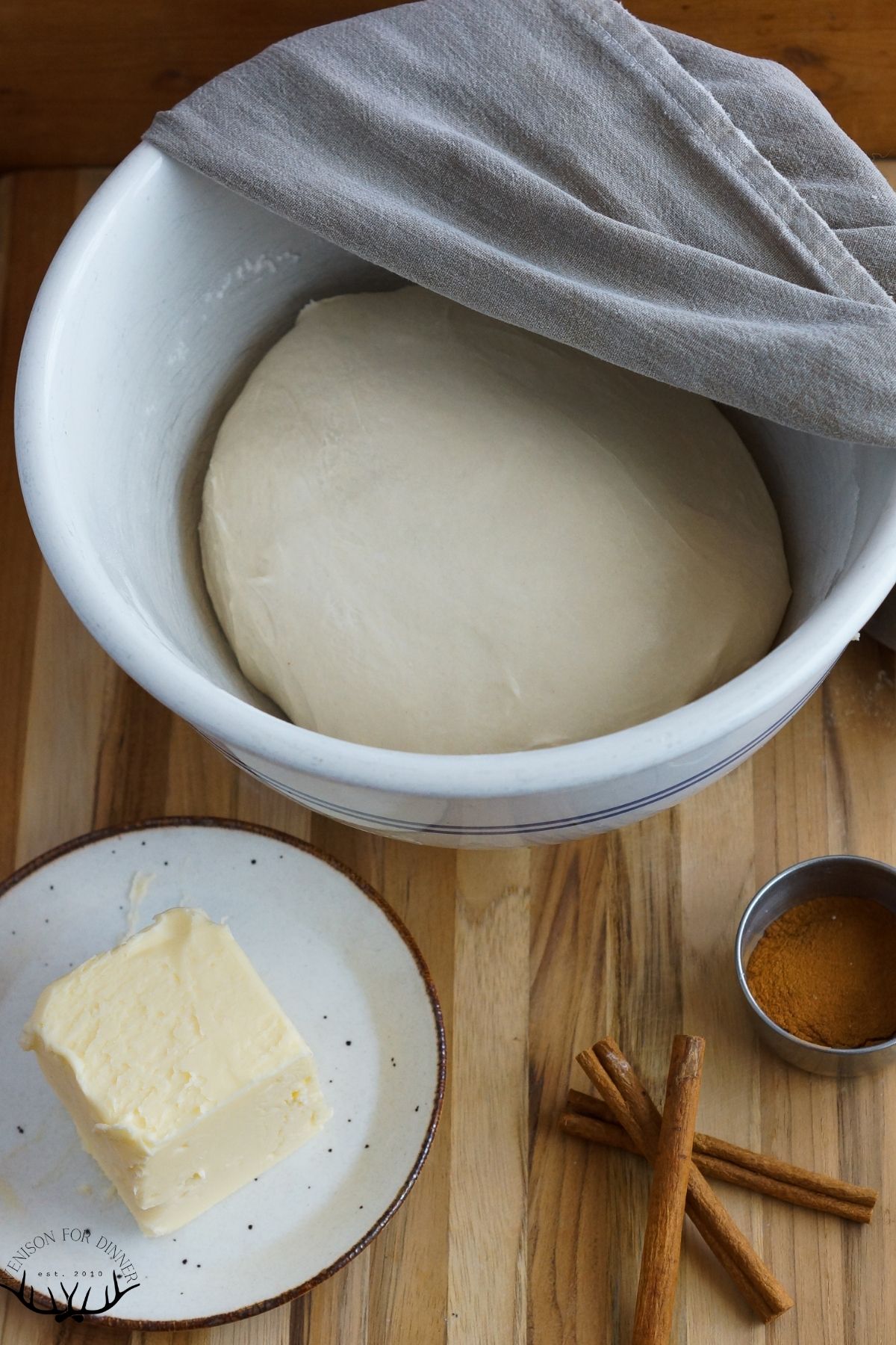 Dough proofing in a covered bowl.