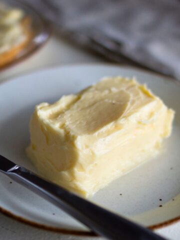 Homemade raw butter on a plate.