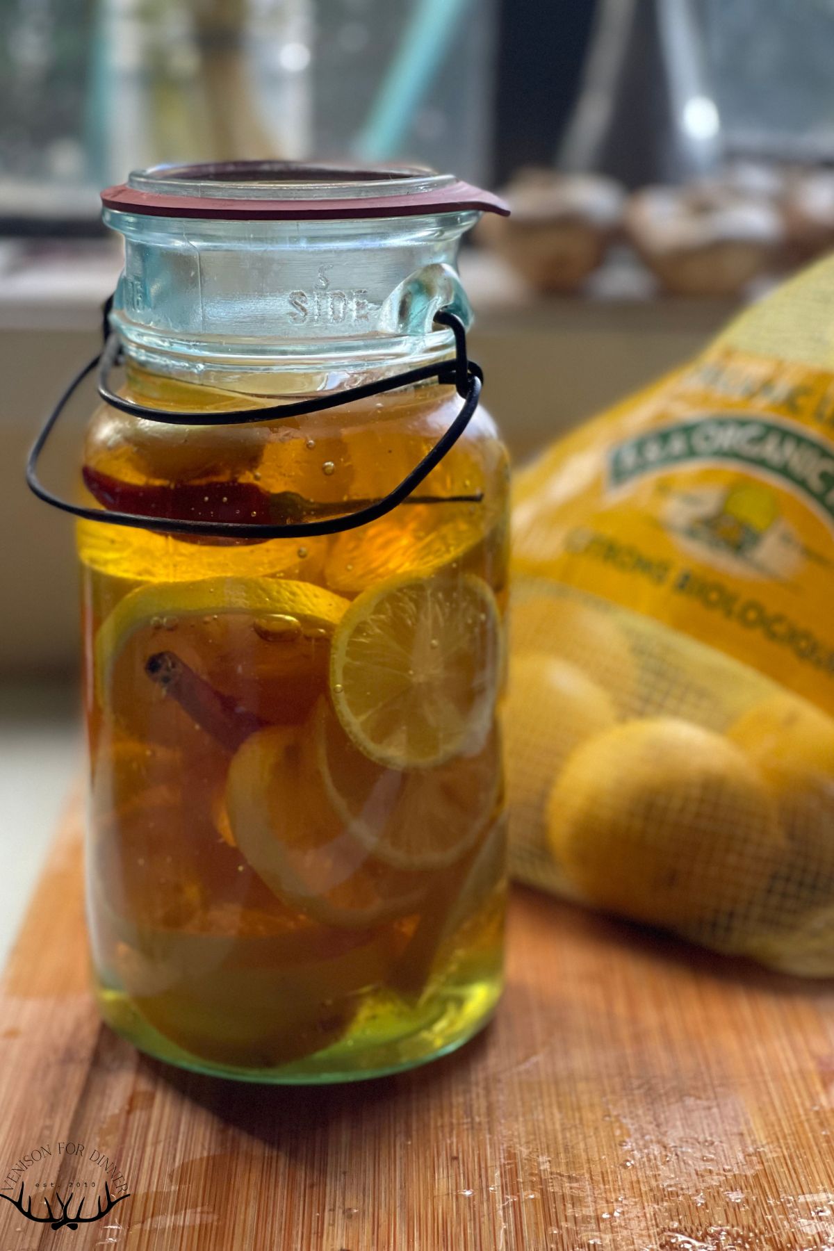 Glass jar of fermented lemons.