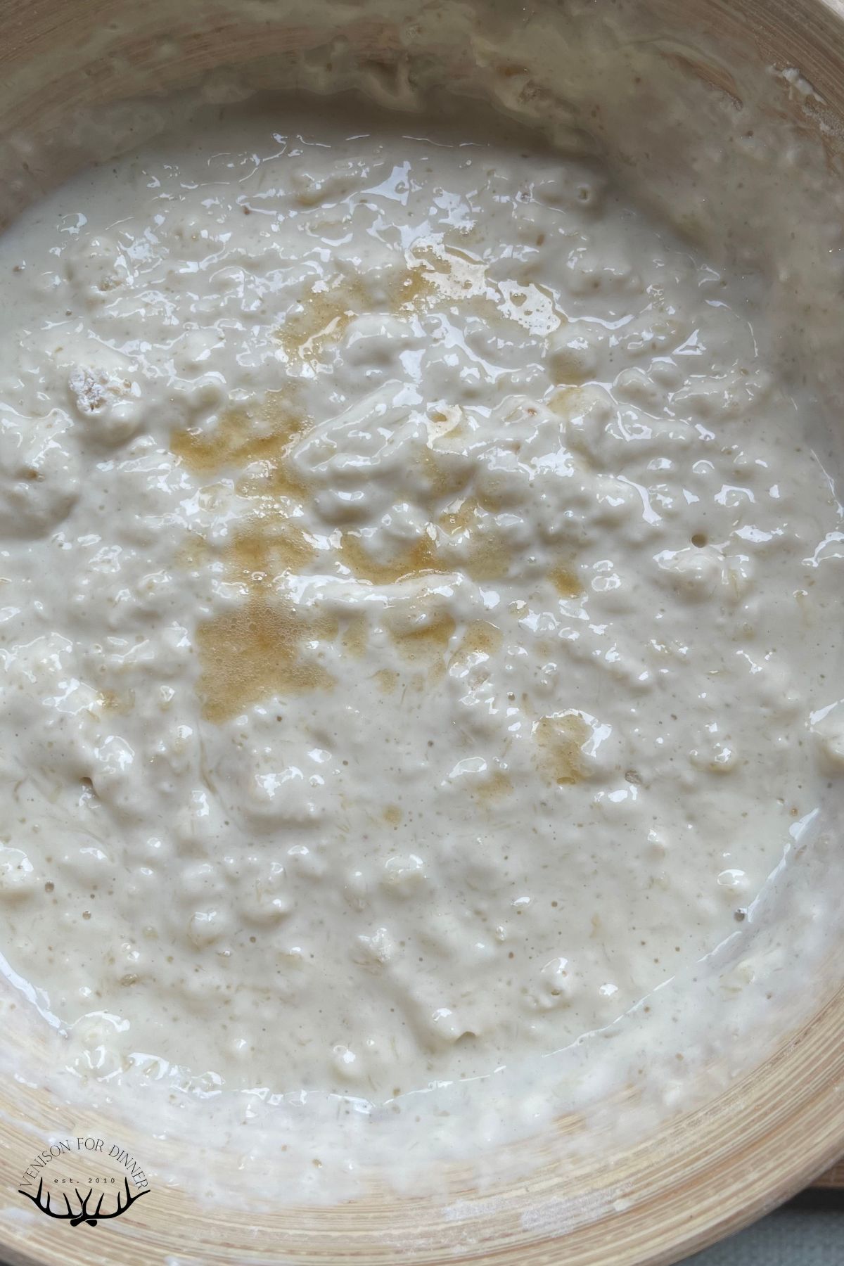 Lumpy pancake batter in a mixing bowl.