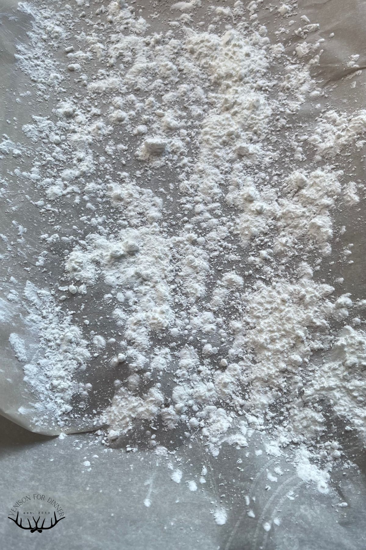 Powdered sugar sprinkled on a counter.