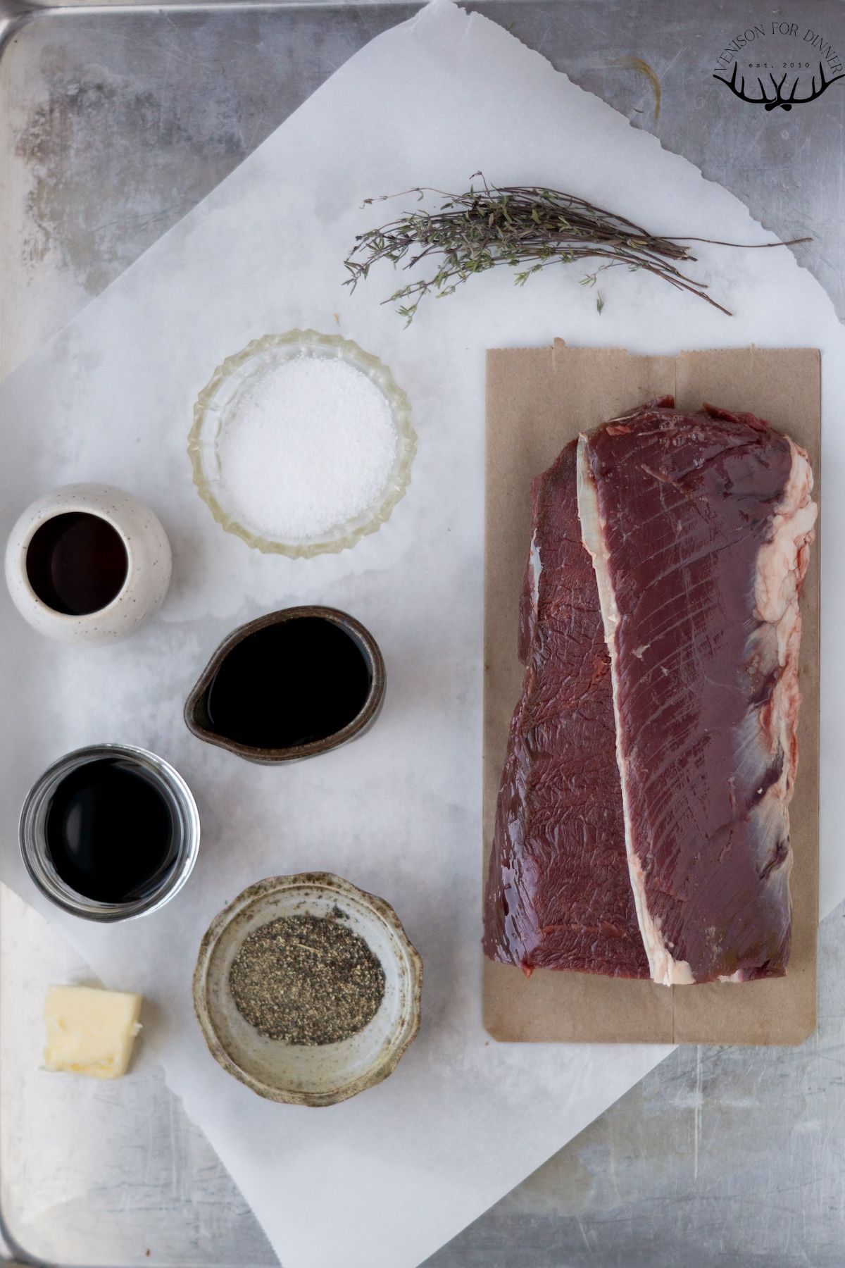 Ingredients for roasted venison backstrap on a counter.