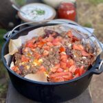 Venison campfire nachos in a dutch oven.