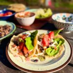 Ground venison tacos with all the toppings.