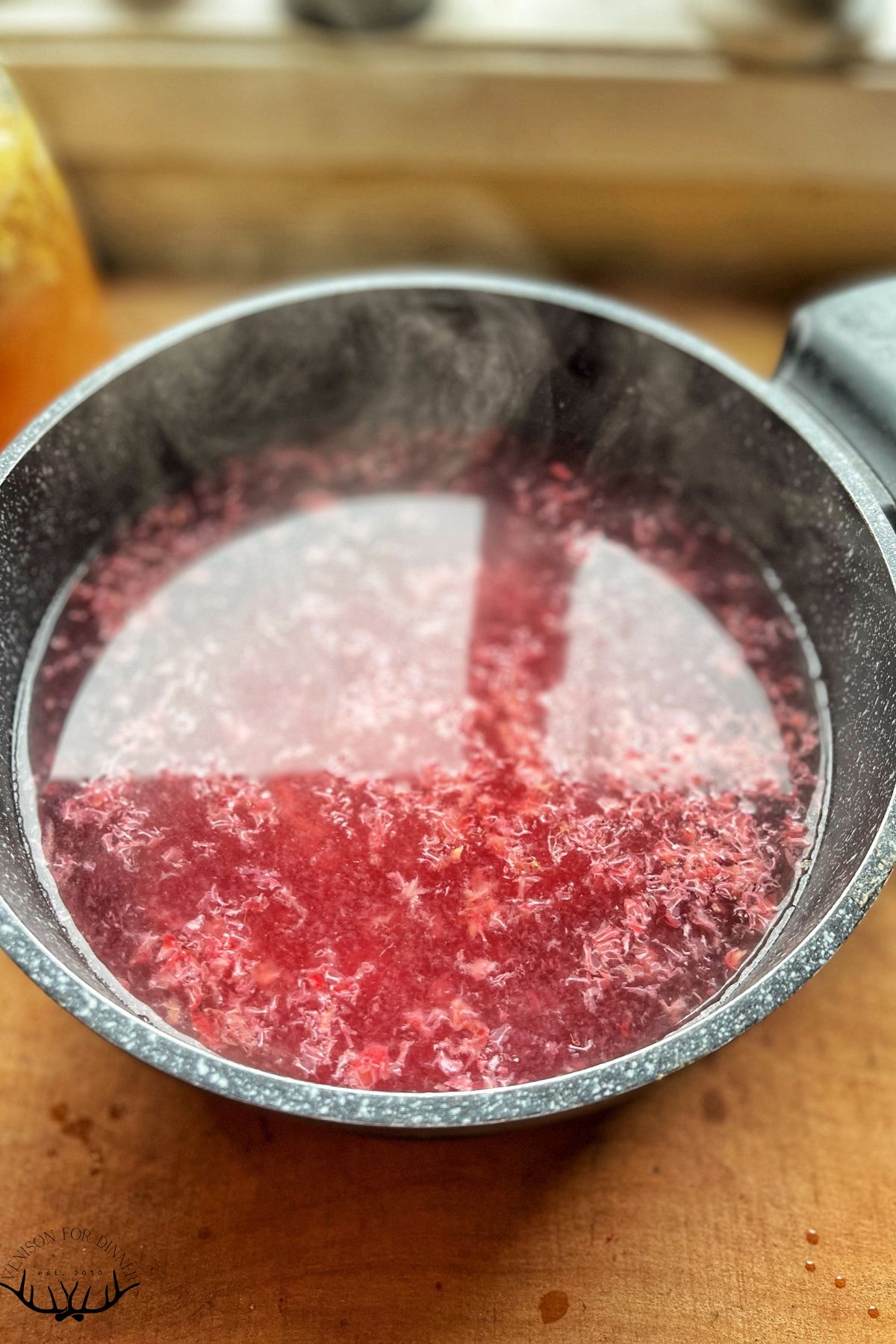 Steeping raspberry pulp.