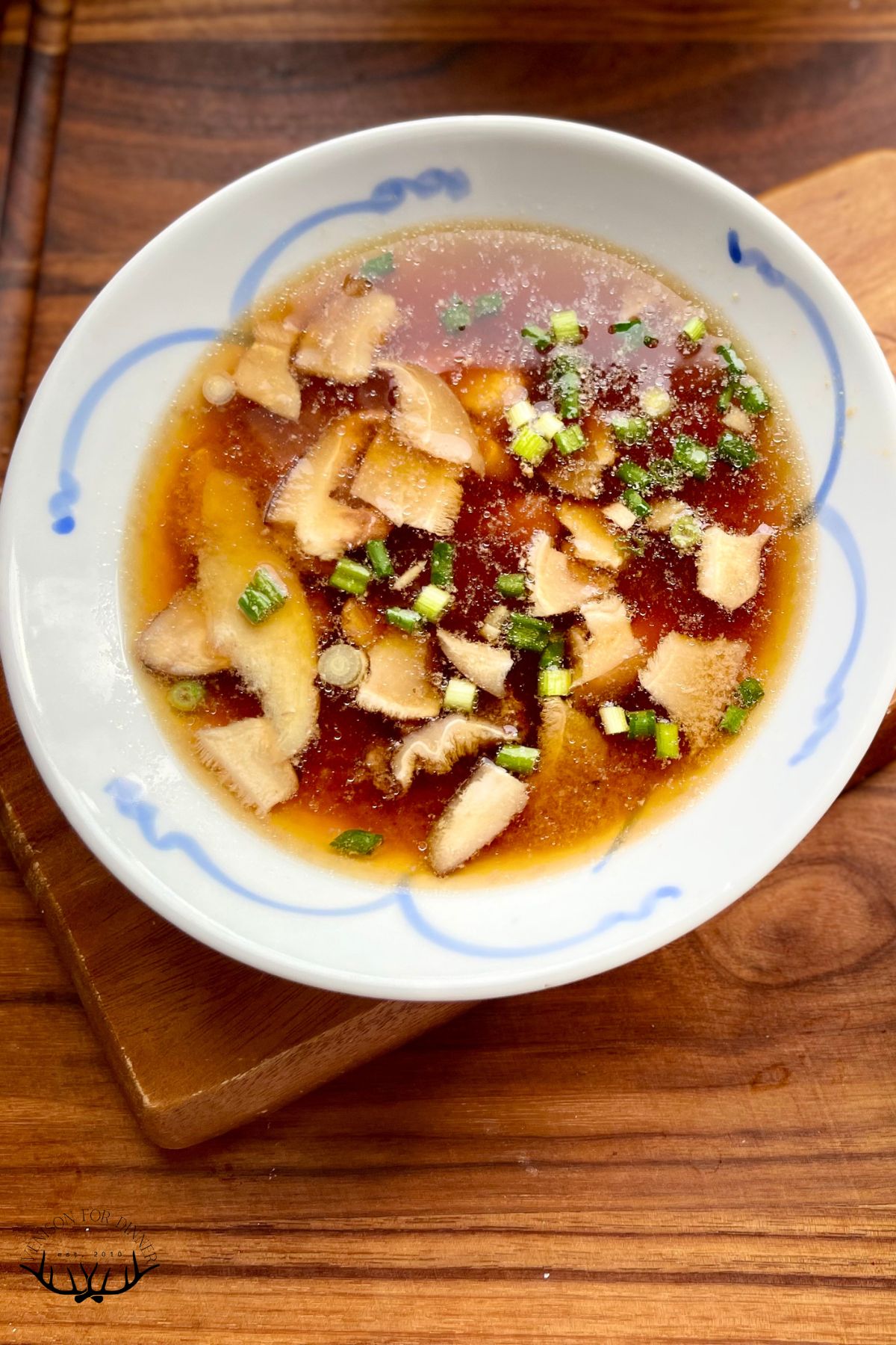 A bowl of miso soup with chicken.