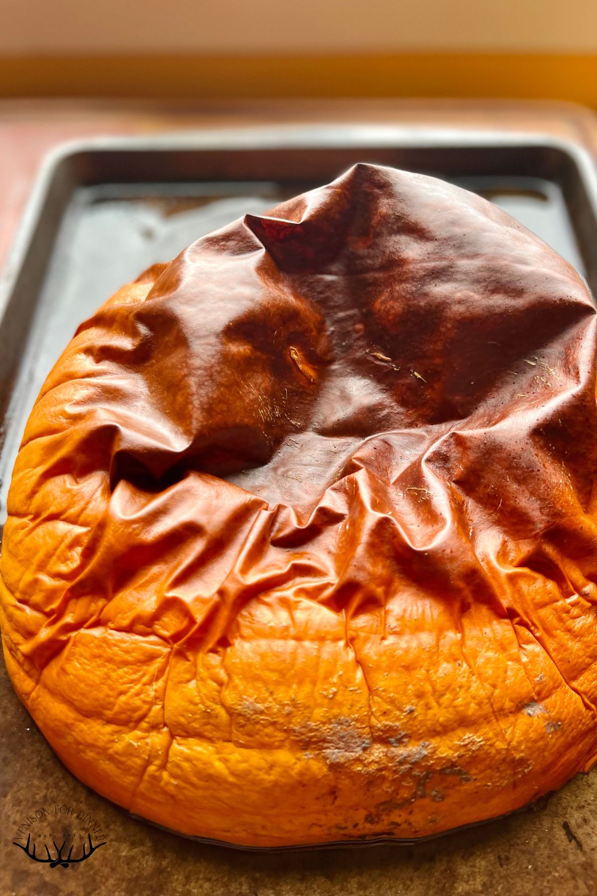 Roasted pumpkin on a baking sheet.