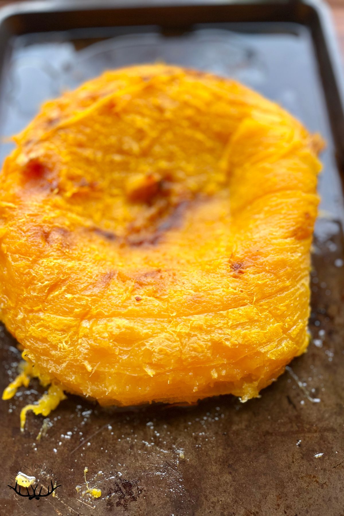 Roasted pumpkin on a baking sheet.