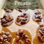 Pecan pralines on a baking sheet.