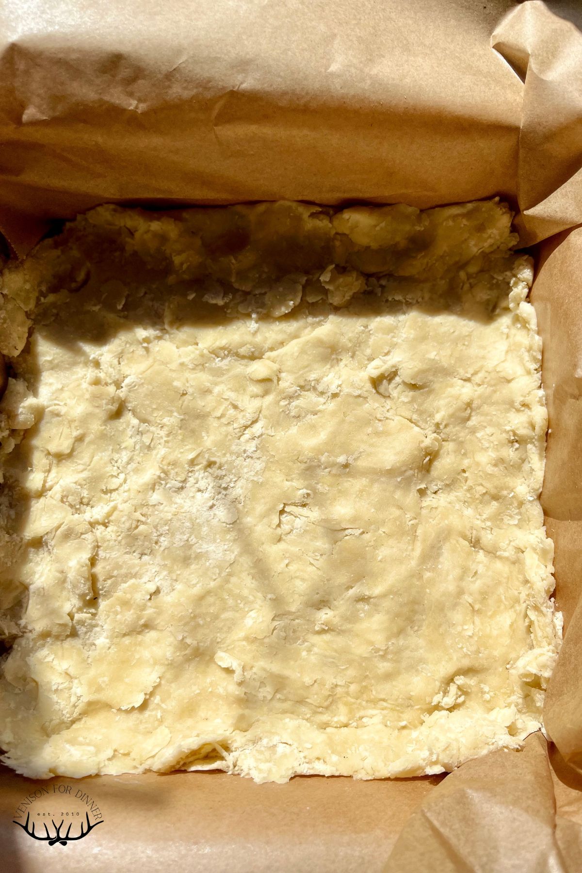 Strudel dough pressed into a baking dish.