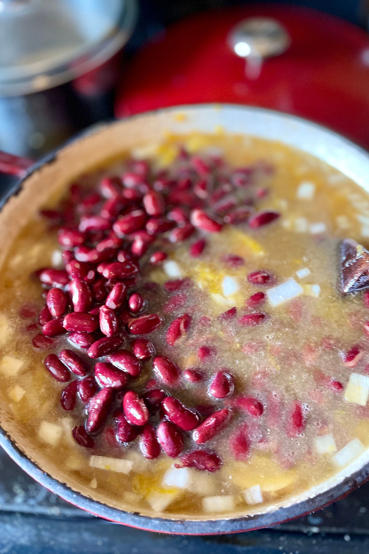 Pumpkin bean soup simmering on the stove.