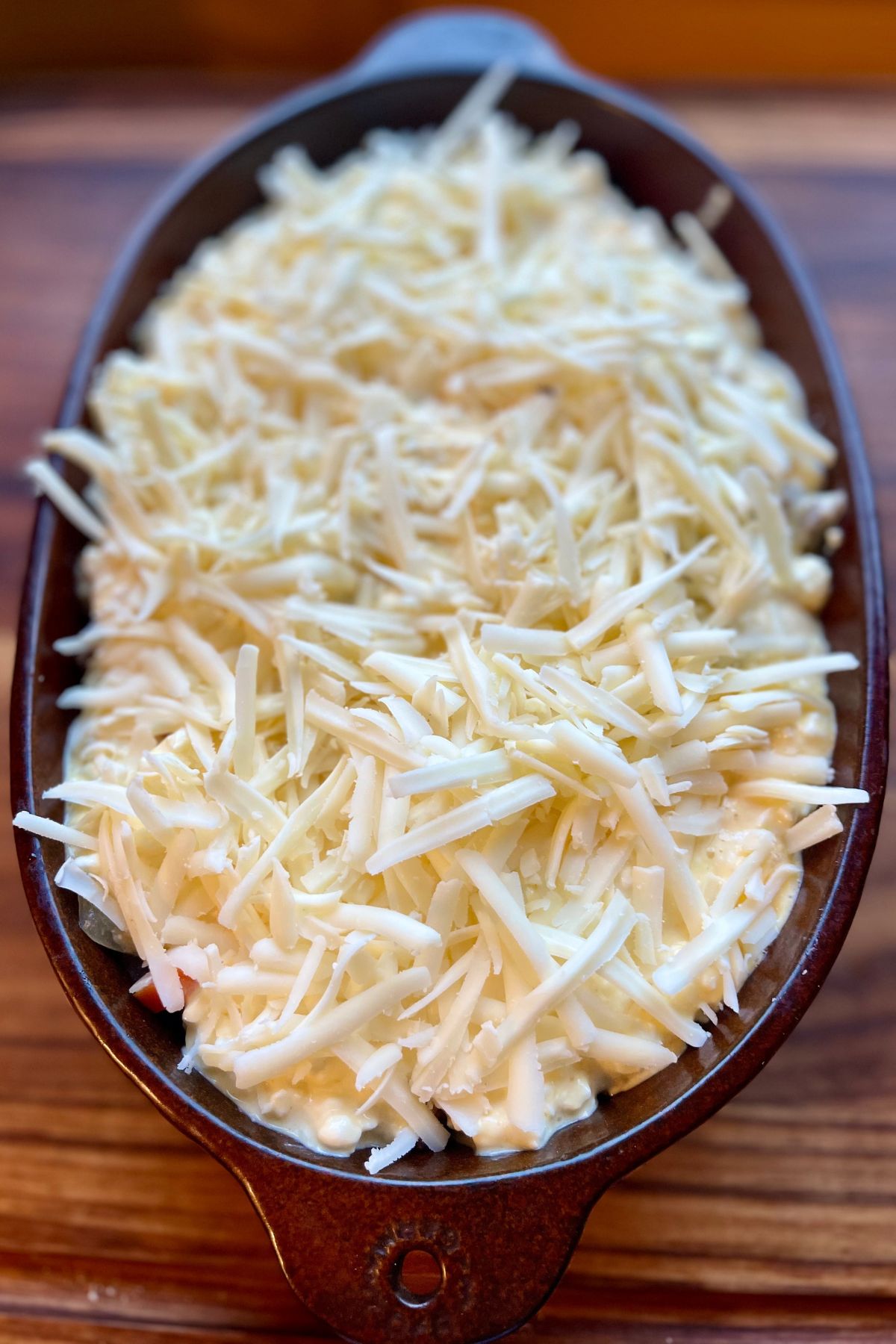 Shredded cheese over venison casserole.