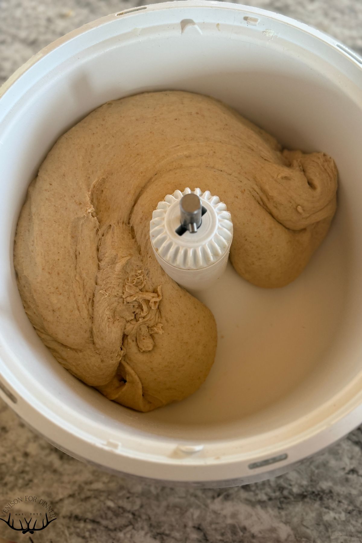Final cinnamon roll dough in the mixer.