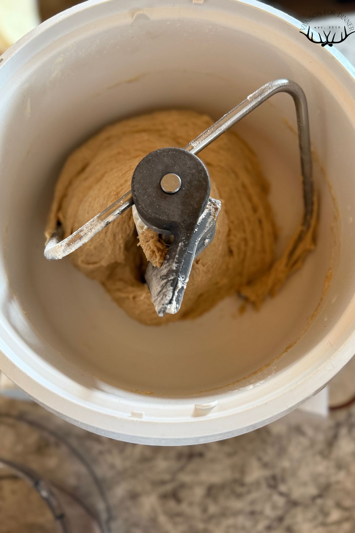 Cinnamon roll dough in a mixer.