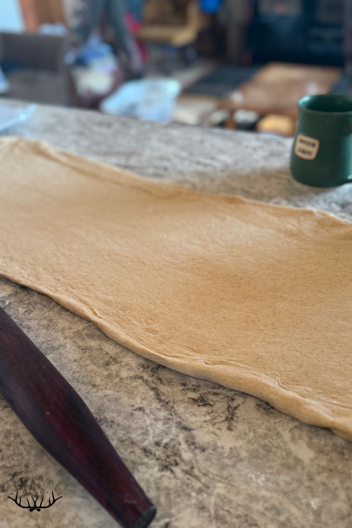 Rolled out cinnamon roll dough.