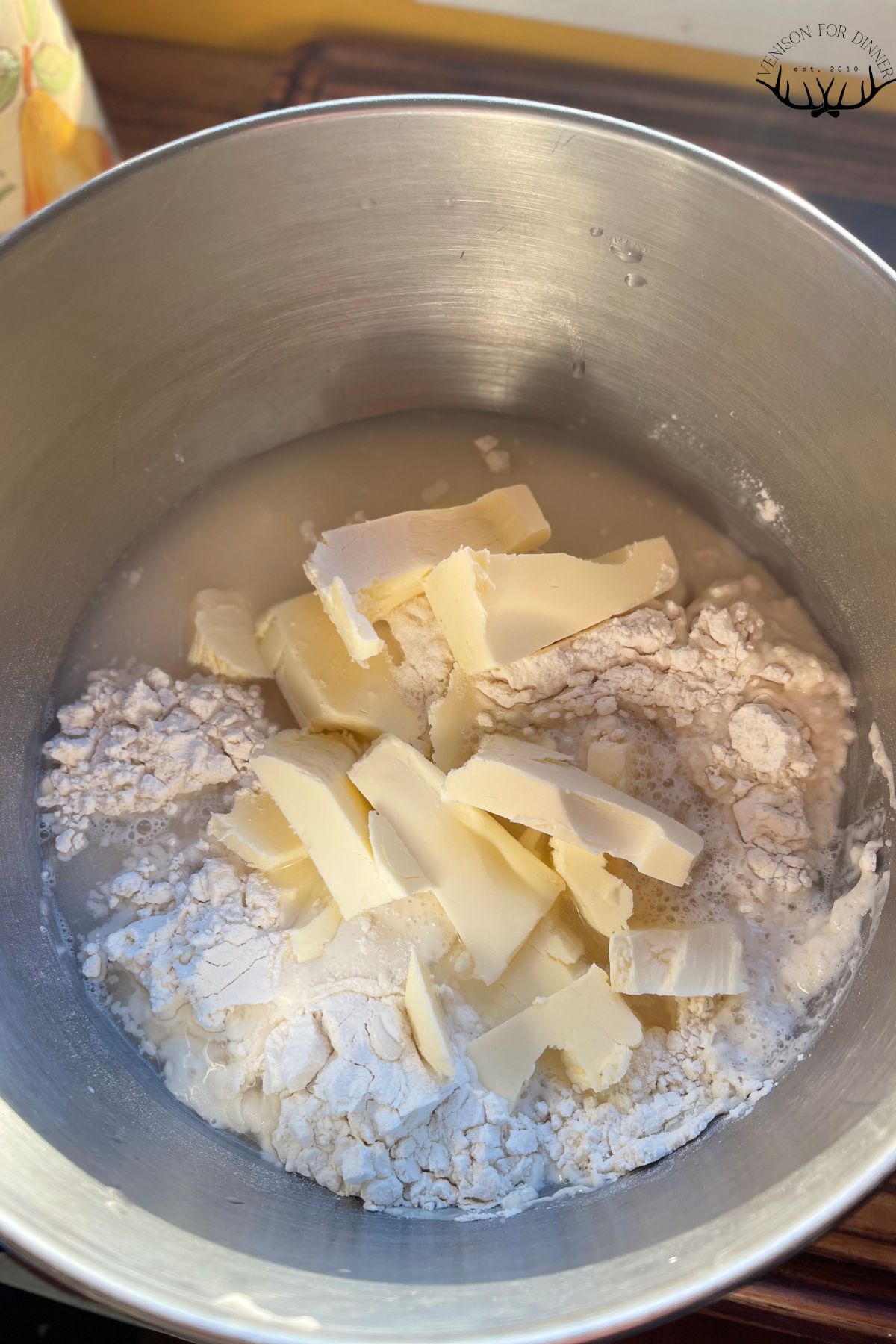 Sourdough bread stick ingredients in the bowl of a mixer.