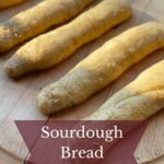 Sourdough bread sticks with garlic sauce.