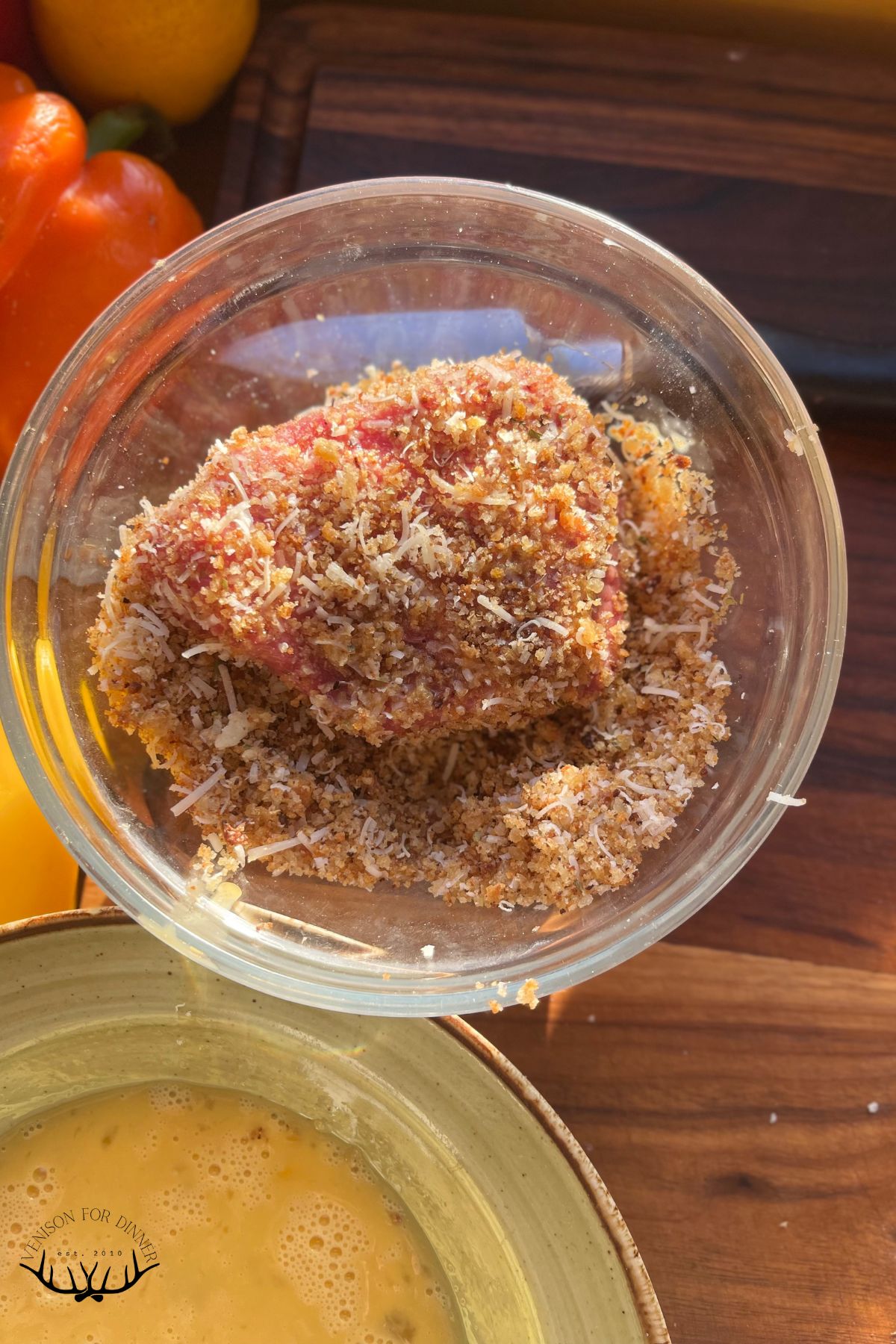 Breading a venison cutlet.