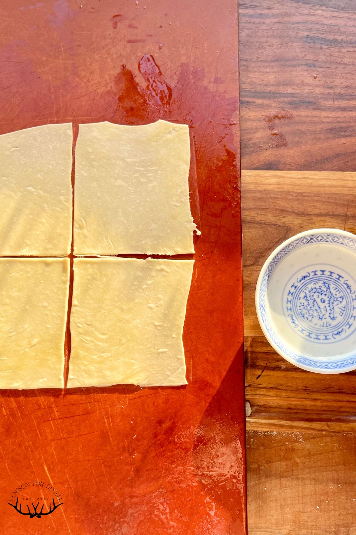 Won ton wrappers with cornstarch slurry for sealing.