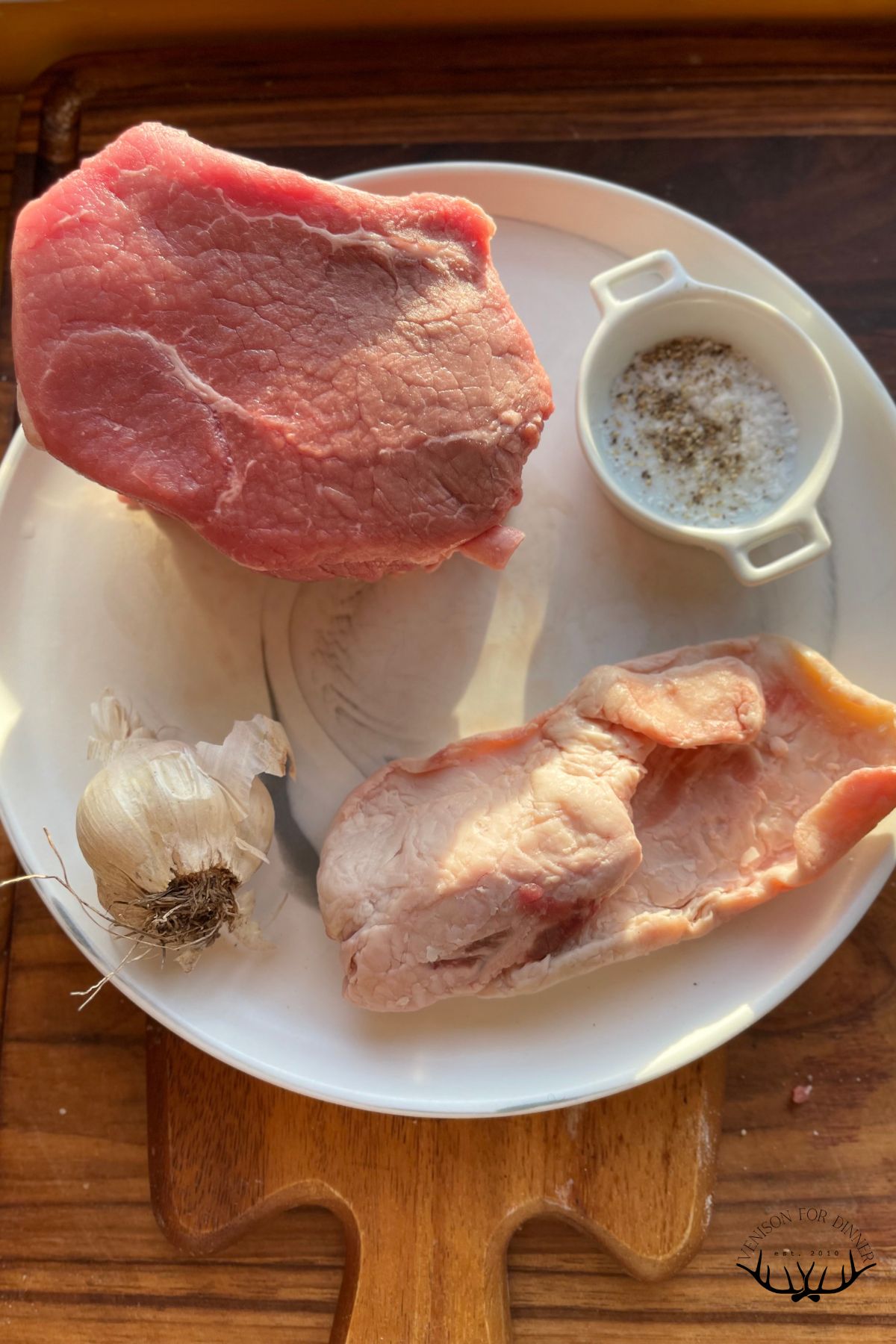 Ingredients to make deer roast in a dutch oven.