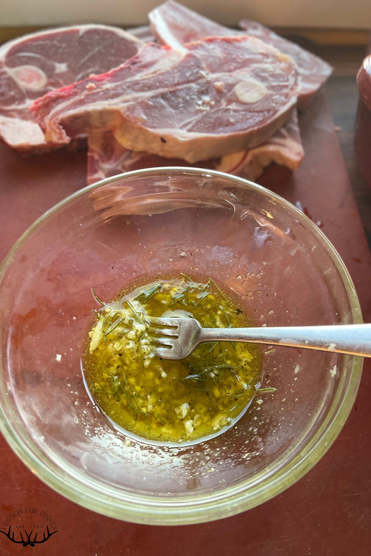 Stirring garlic into oil.