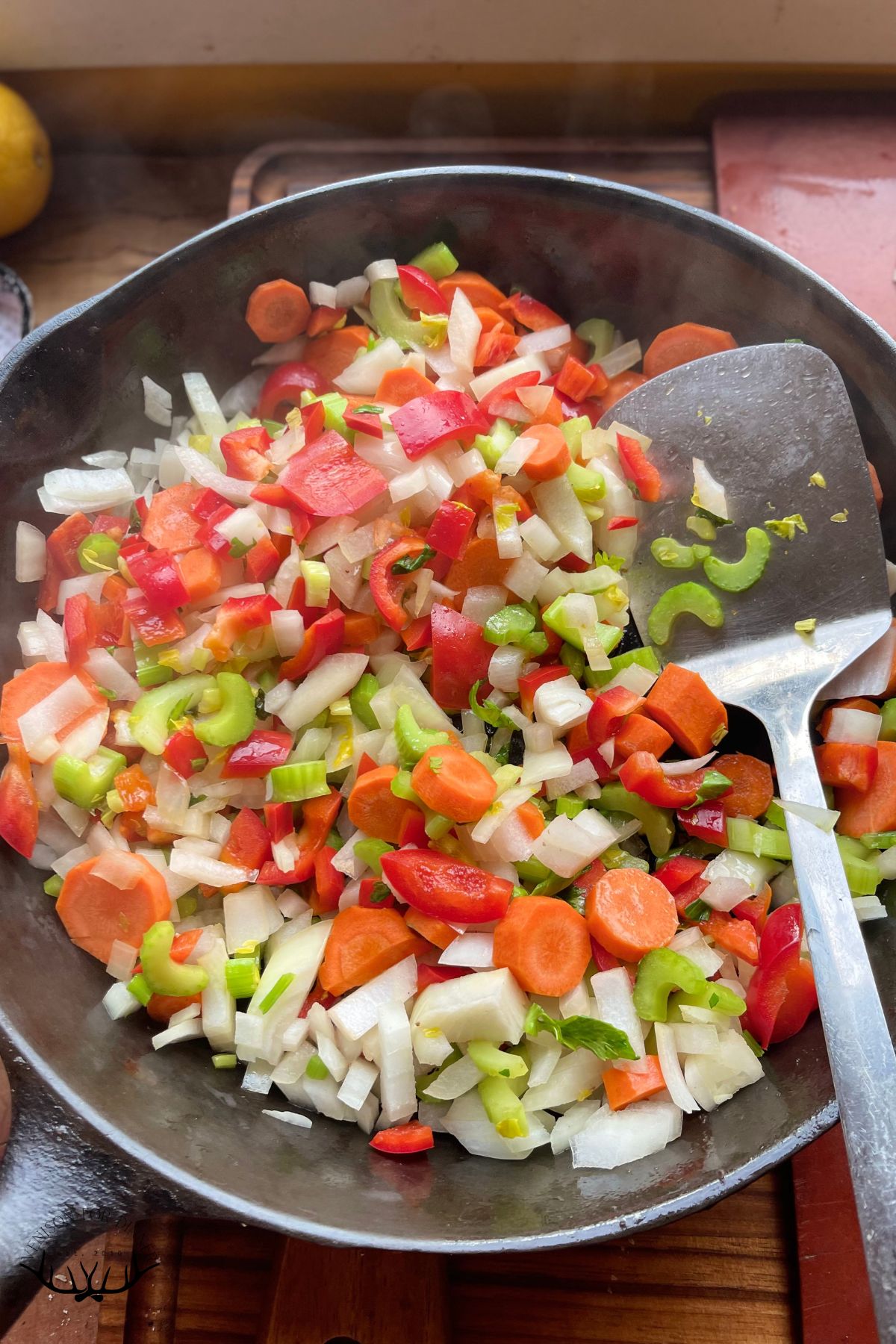 Diced veggies in a skillet.