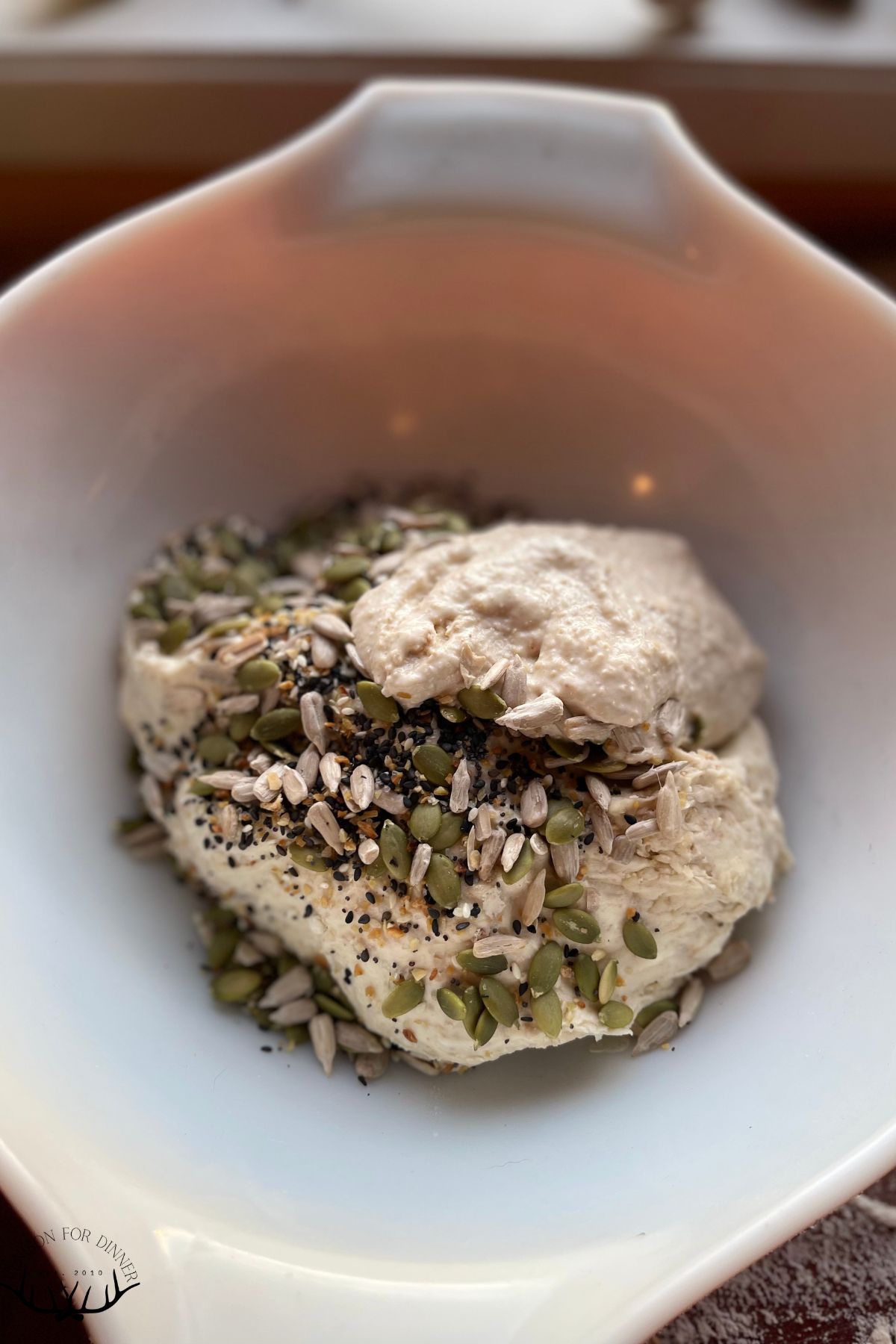 Kneading seeds into sourdough.