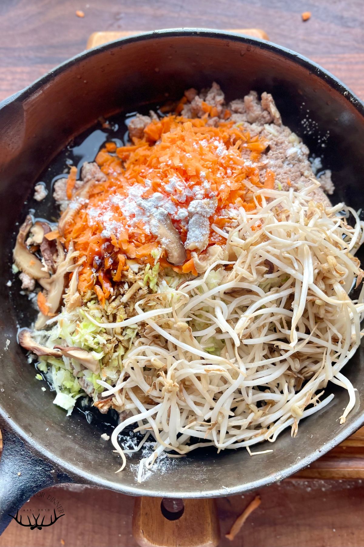 Filling for spring rolls in a skillet.