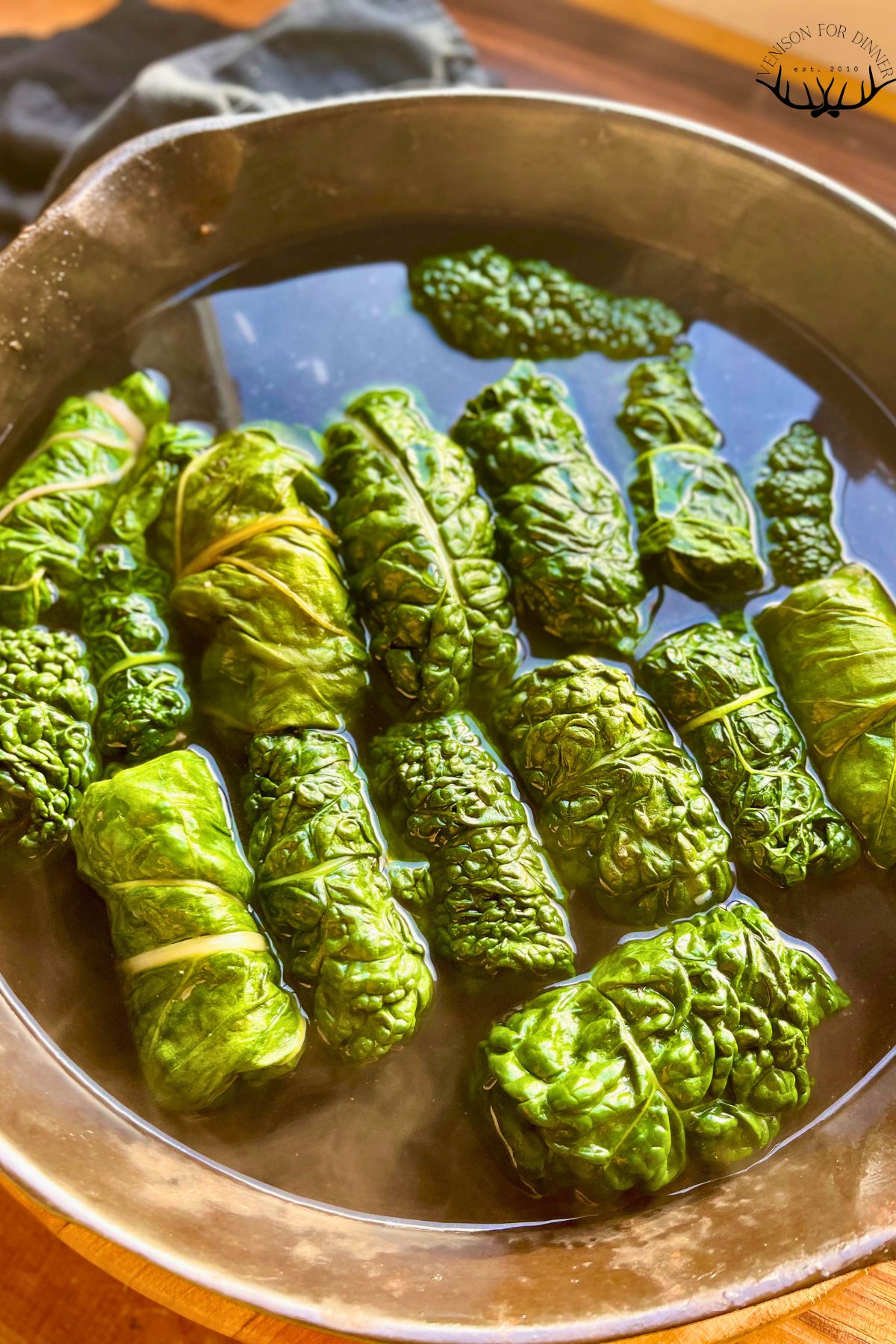 Pork dolmades in a pan.