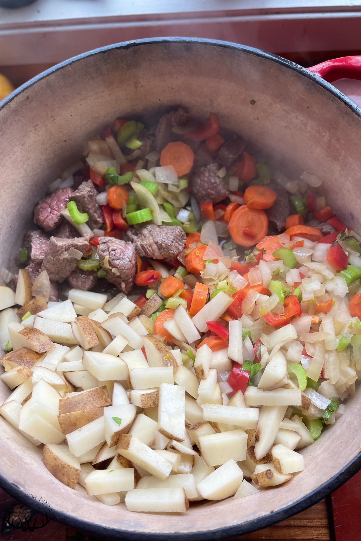 Sautéed veggies in a stockpot.