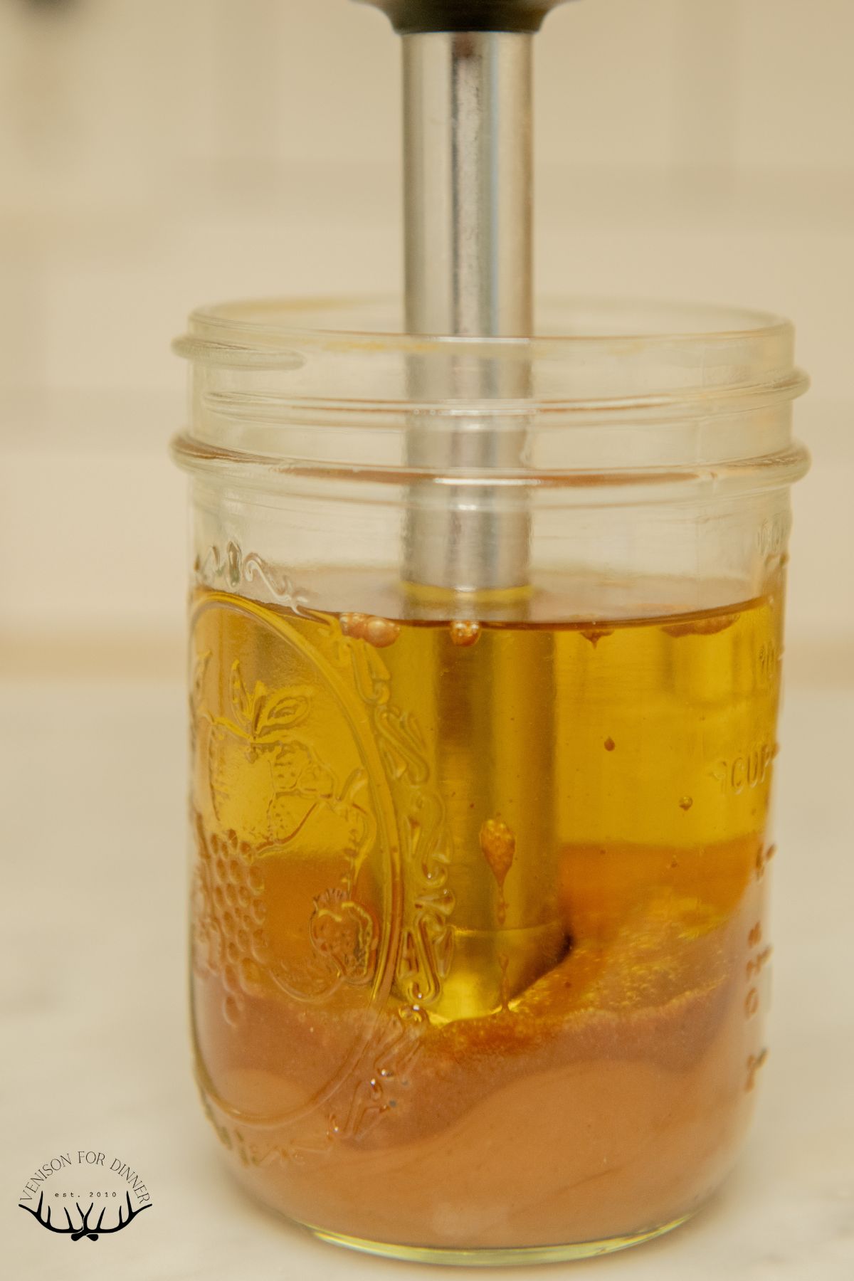 Beginning to blend a jar of salad dressing.
