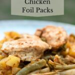 Chicken foil packets made in a campfire.