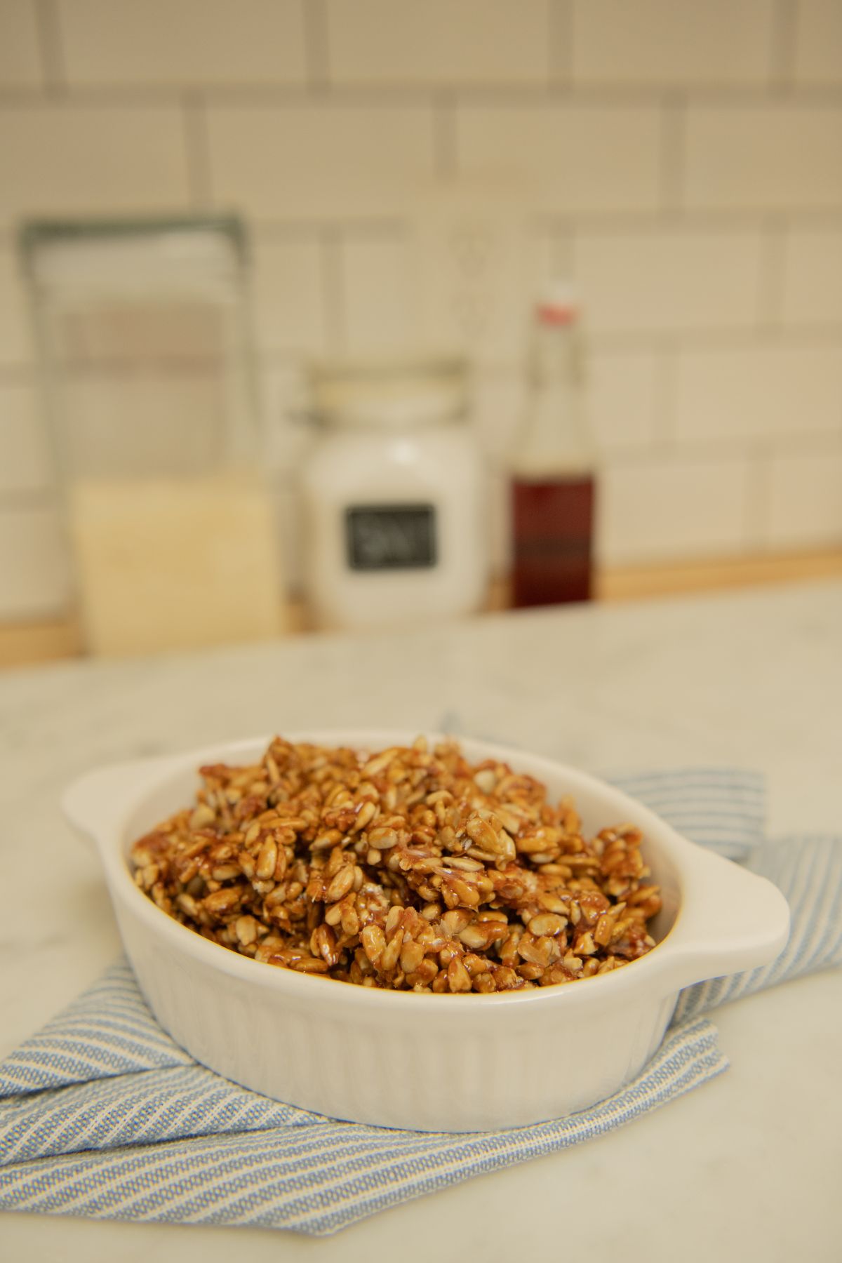 Candied sunflower seeds in a dish.