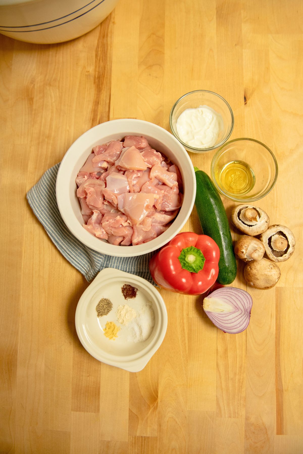 Ingredients to make chicken and veggie skewers.