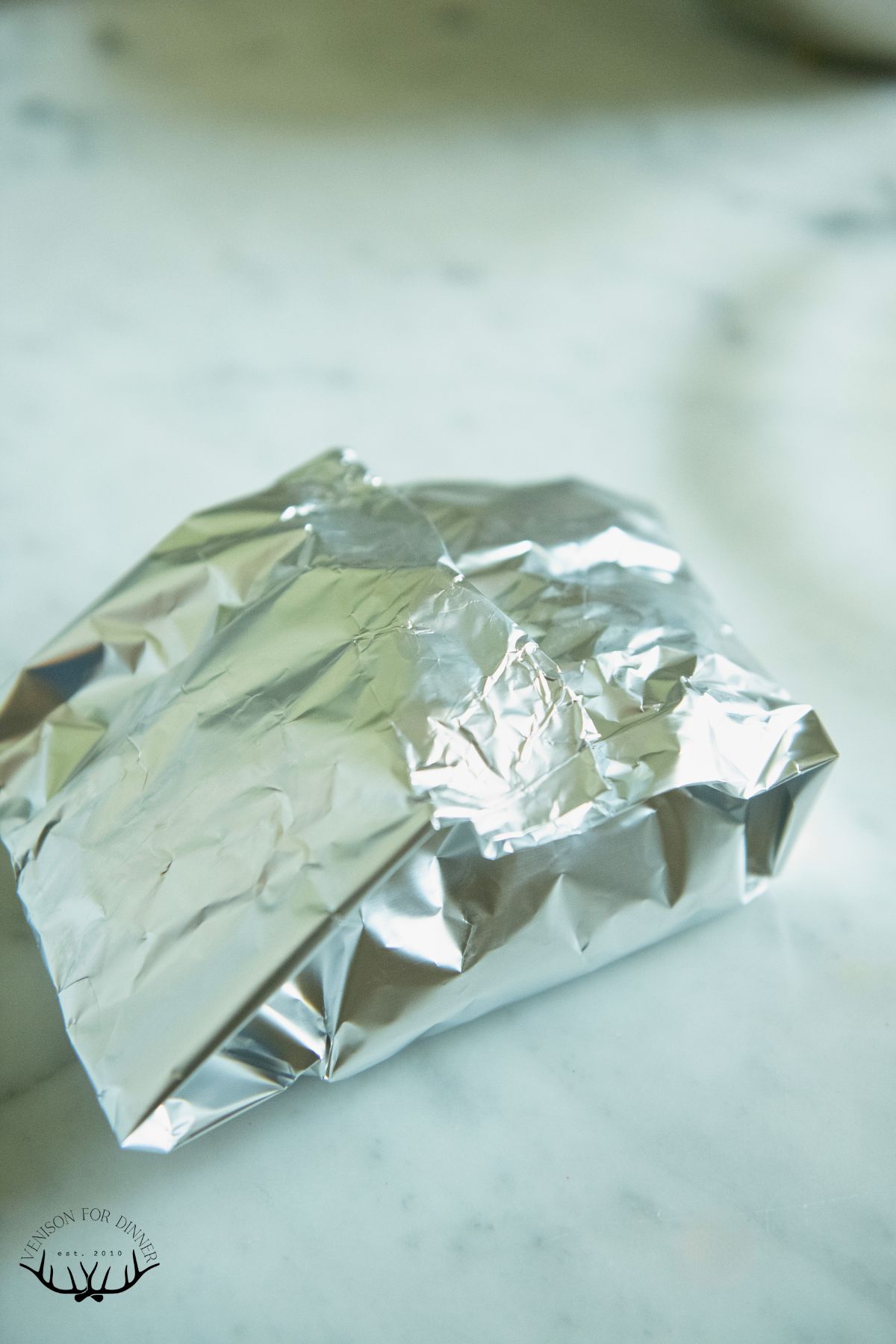 Fully wrapped chicken foil pack.