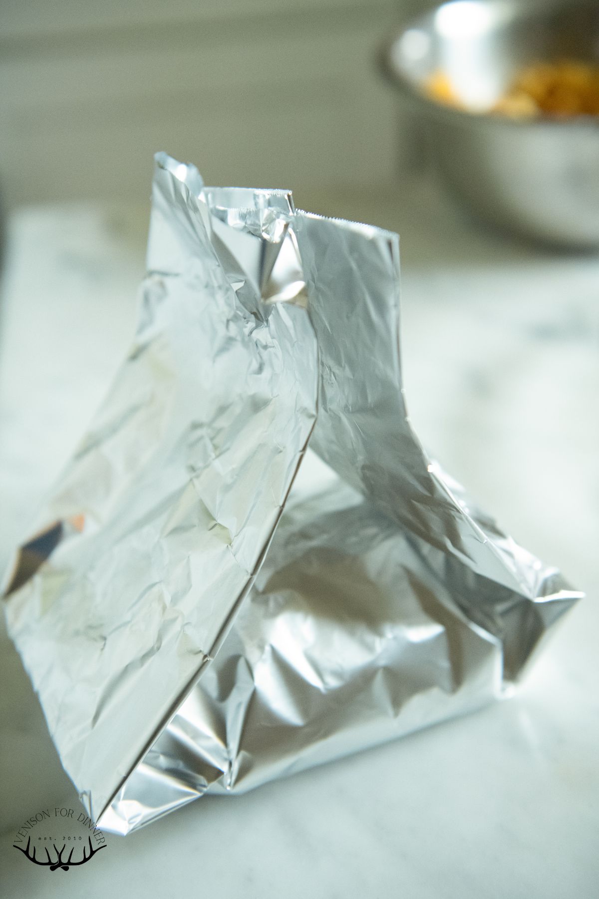 Tenting foil around chicken.