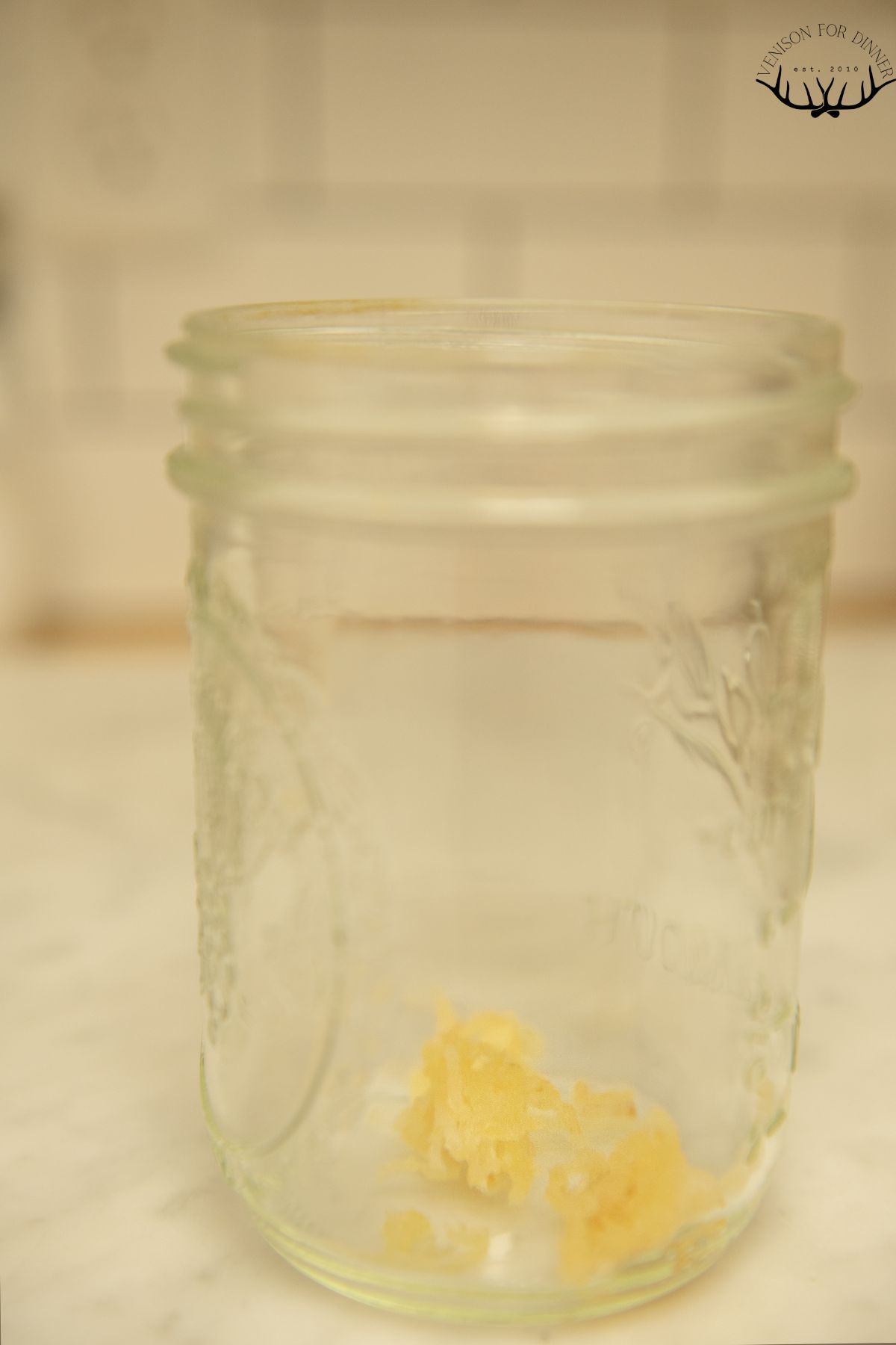Minced garlic in a glass jar.