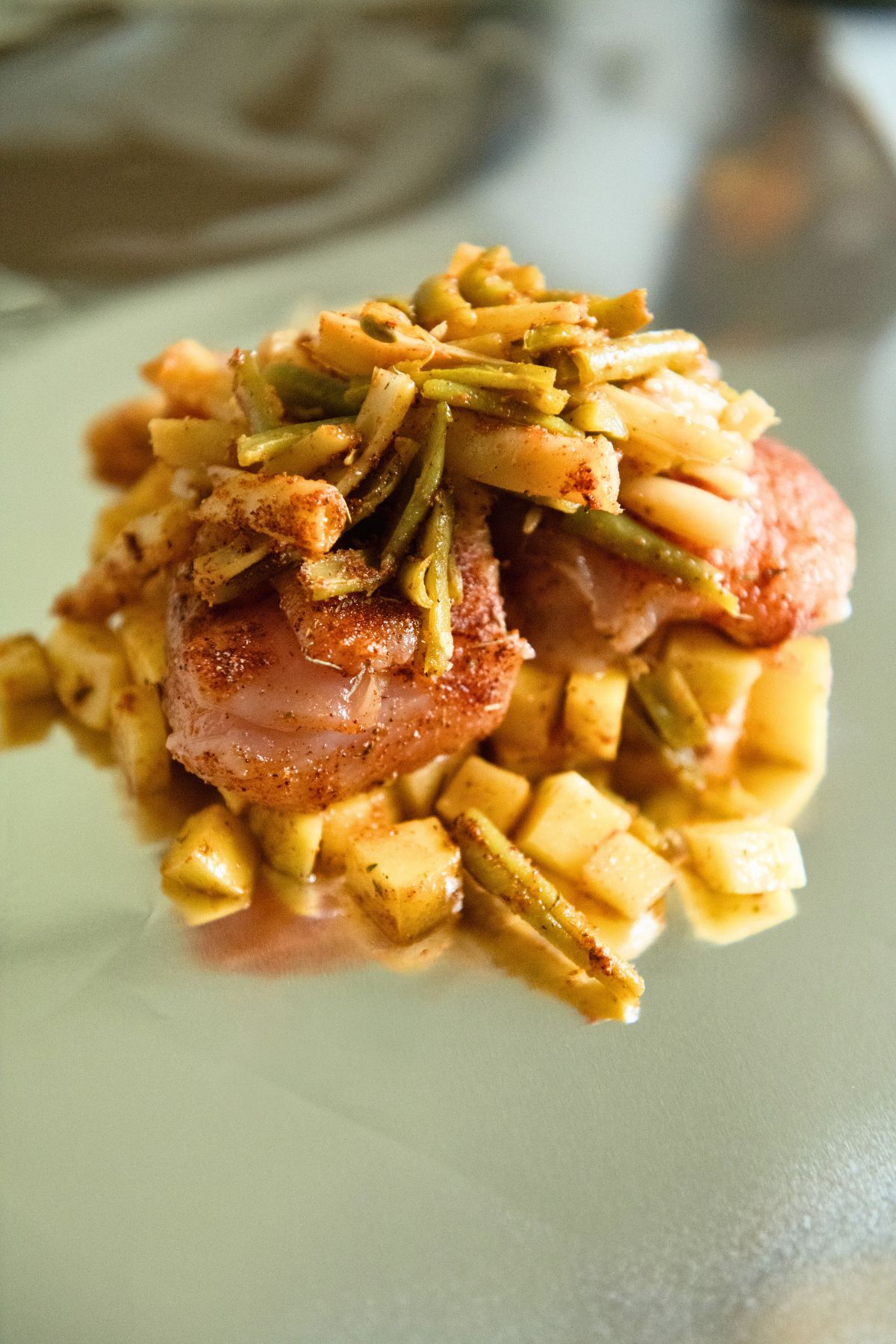 Chicken and veg on a piece of foil.