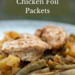 Grilled chicken foil packets served on plates.