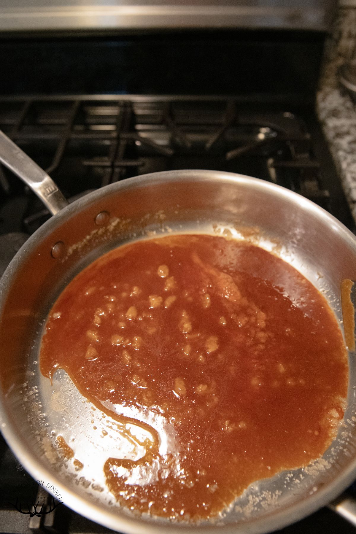 Making caramel in a saucepan.