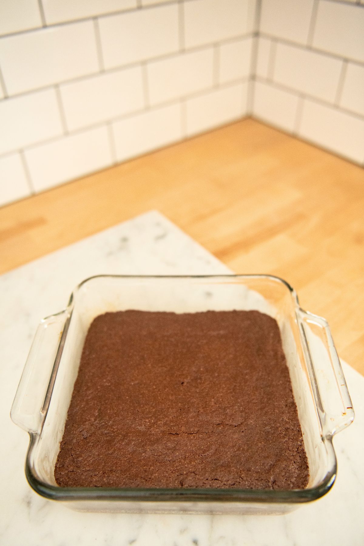 Brownies baked in a square pan.