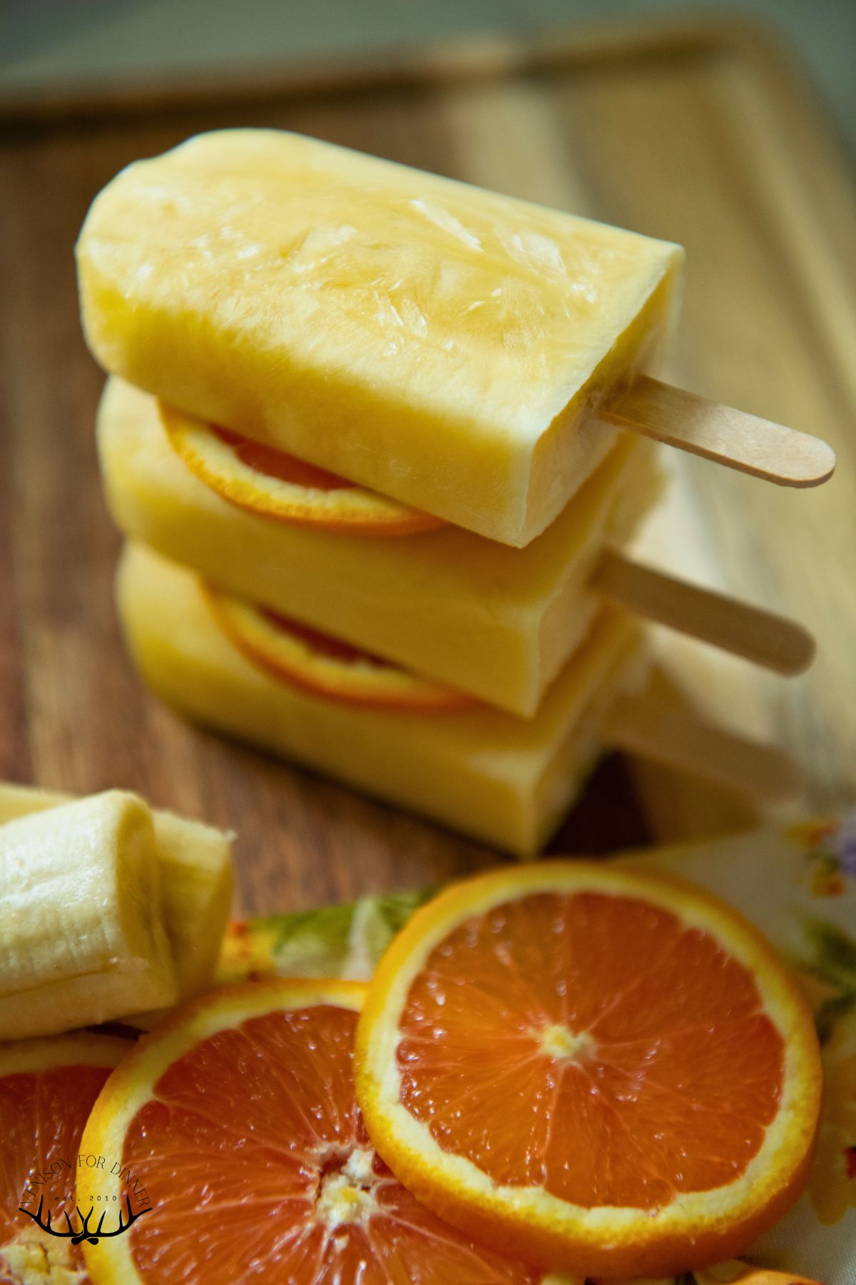 Stack of banana orange popsicles.