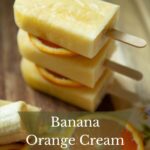 Stack of banana orange popsicles ready to serve.