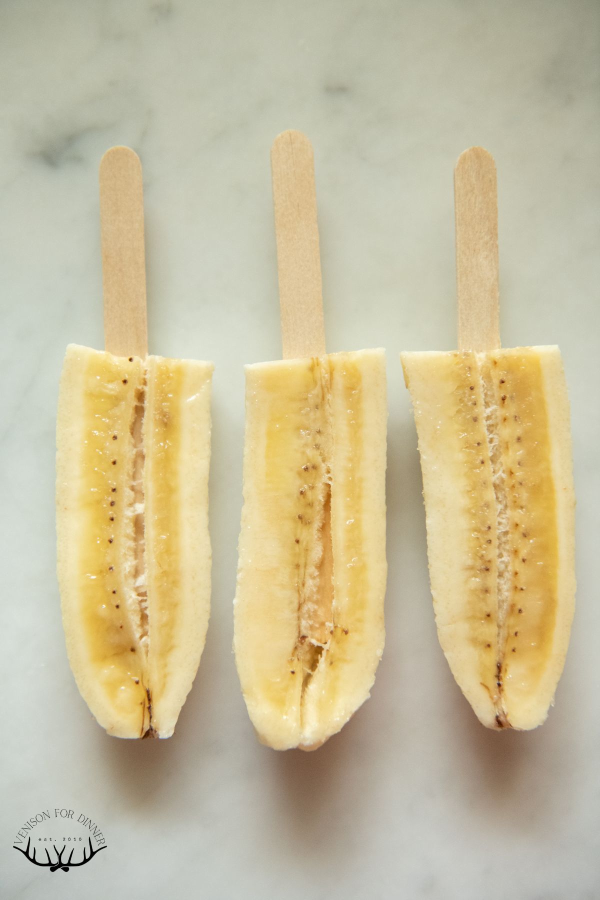 Popsicle sticks in banana quarters.