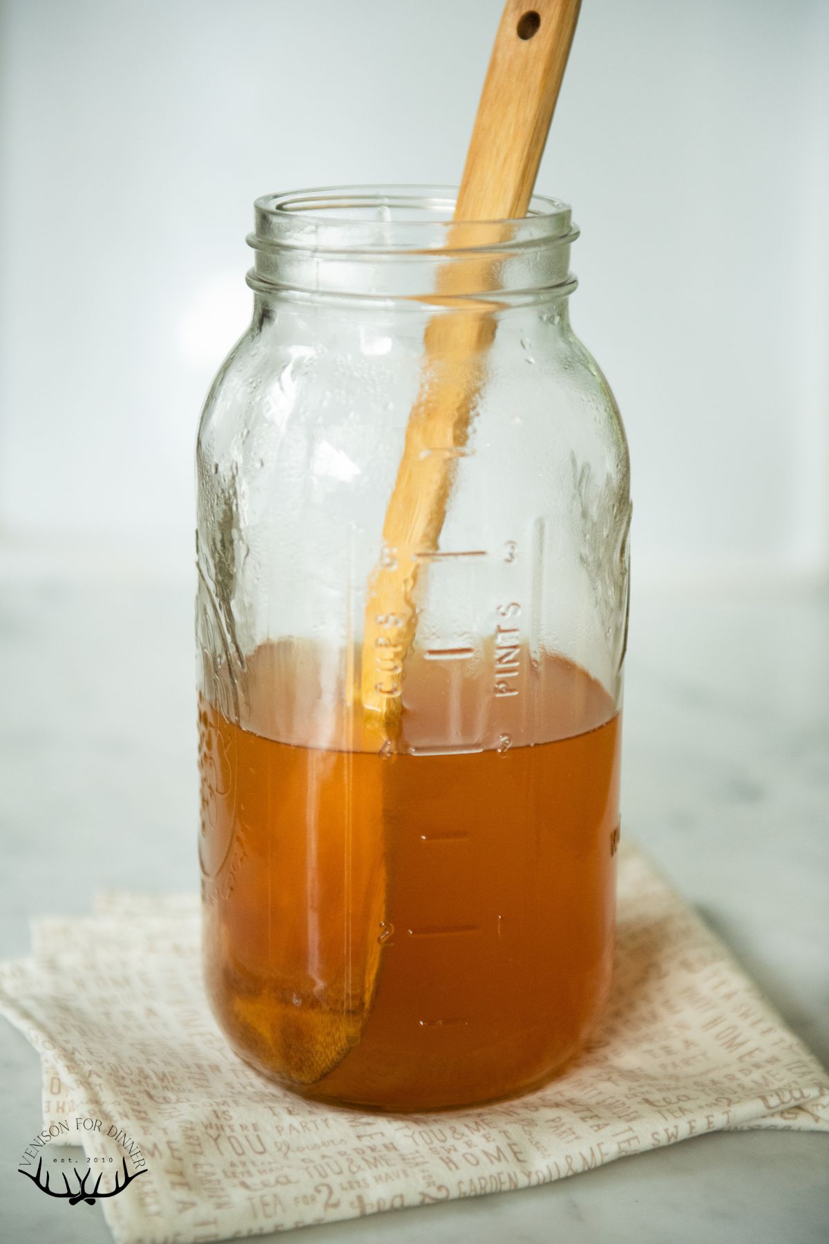 Dissolving honey in brewed tea.