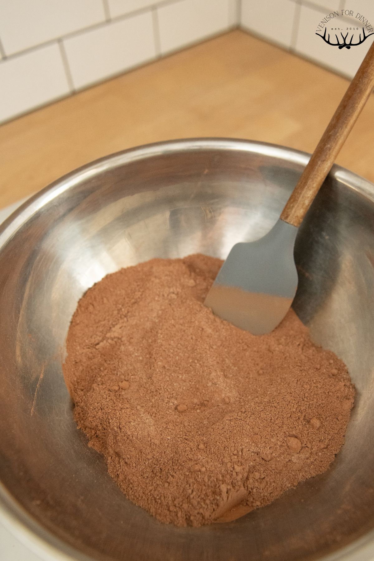 Dry brownie ingredients in a mixing bowl.